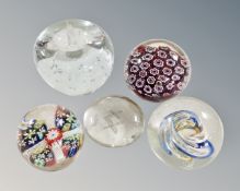 Five glass paperweights including millefiori apple with controlled bubbles, Masonic examples etc.