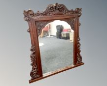 A Victorian carved oak overmantel mirror.