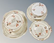 Twenty-two pieces of Alfred Meakin dinner china, including plates, turines and serving platters.