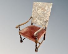 A 20th century continental oak barleytwist open armchair.