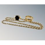 A 9ct gold band ring, another 9ct ring with a black stone and a 9ct gold rope twist chain.