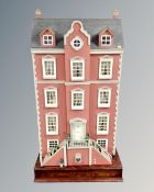 An impressive Georgian style five story doll's house together with a large quantity of doll's house