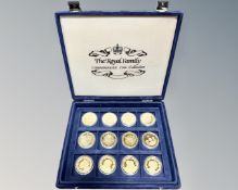 Twelve commemorative Royal family coins in case.