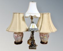 A pair of ceramic floral patterned table lamps with shades together with two further table lamps,