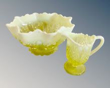 A shaped Vaseline glass bowl (diameter 25cm) together with a similar jug.