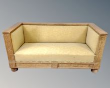 An early 20th century carved oak framed hall settee