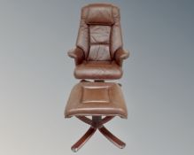 A 20th century Danish swivel armchair and stool upholstered in dark brown leather