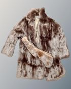 A brown mink fur coat with wrap.