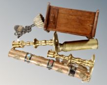 A brass telescope and candlesticks