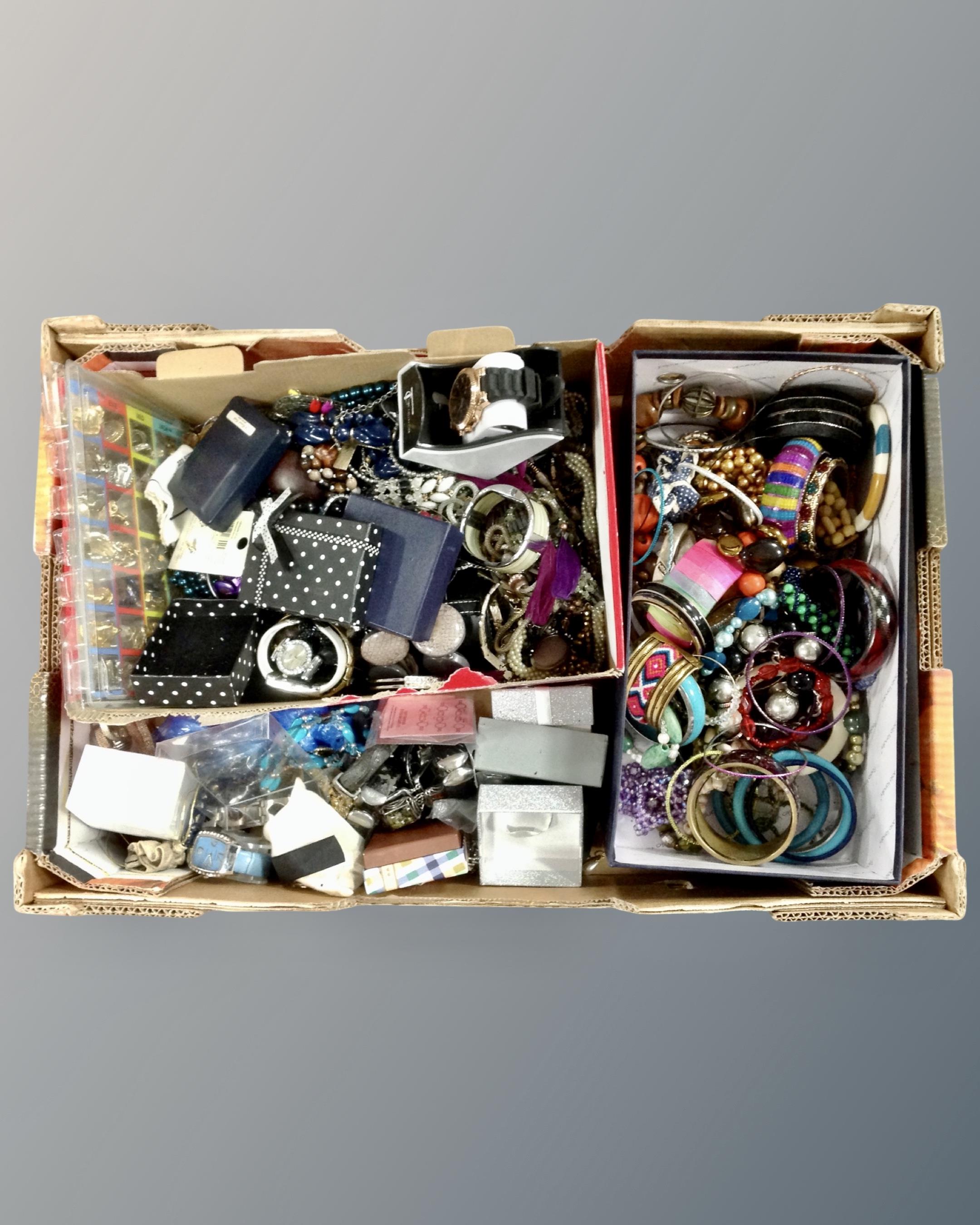 A box of costume jewellery including a large quantity of bangles, beads, necklaces etc.