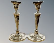 A pair of George V loaded silver candlesticks, Goldsmiths & Silversmiths Co, London 1911,