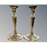 A pair of George V loaded silver candlesticks, Goldsmiths & Silversmiths Co, London 1911,