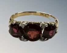 An antique 18ct gold garnet and diamond ring