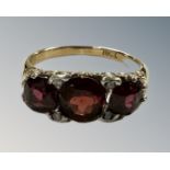 An antique 18ct gold garnet and diamond ring