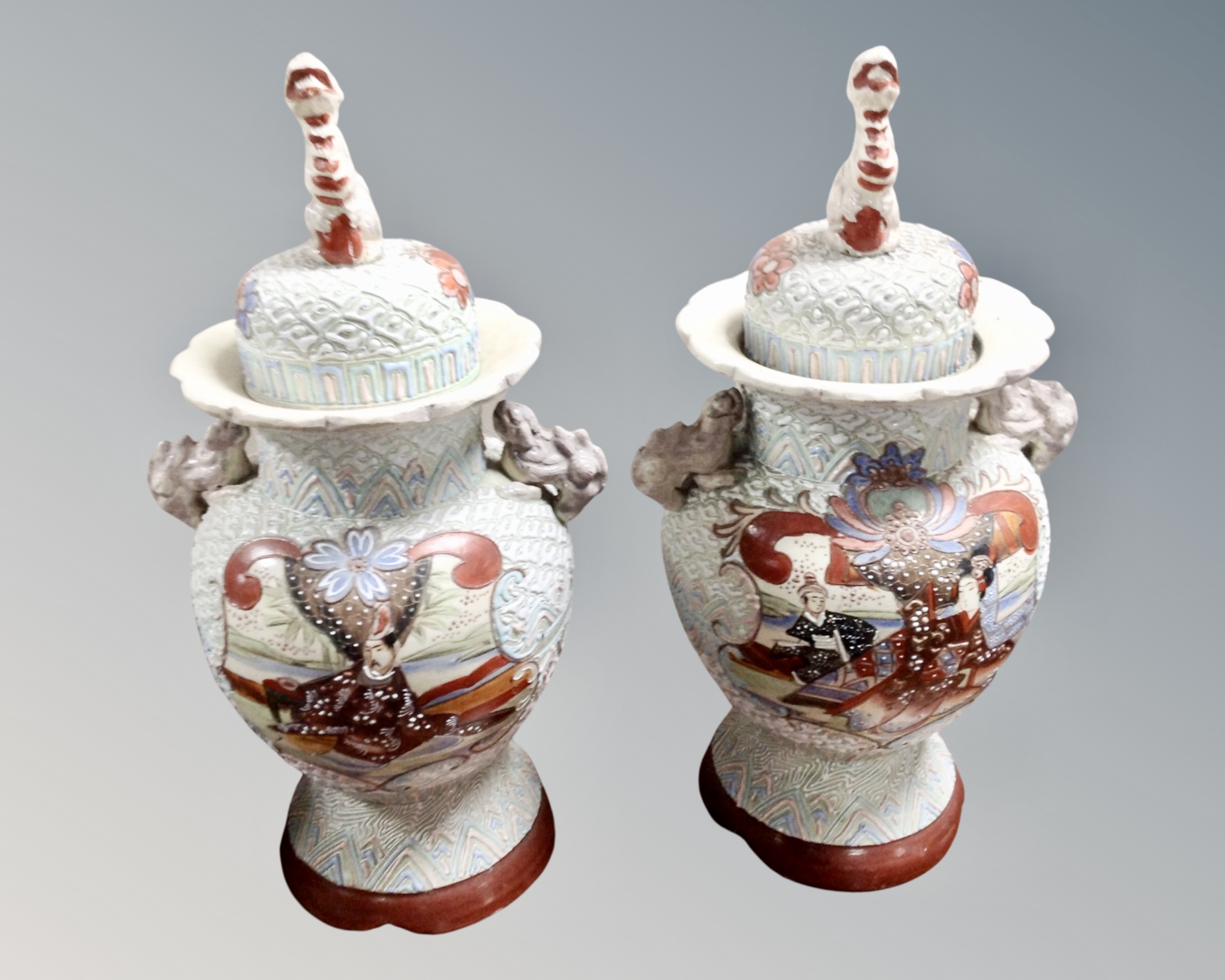 A pair of 20th century Japanese export lidded vases.