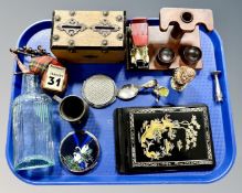 A tray of collectables including money box, poison bottle, Stratton compact bagpipe, calendar etc.