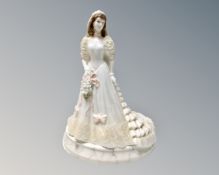 A Coalport figure, Bride of the Year '94 Wedding Bells, boxed.