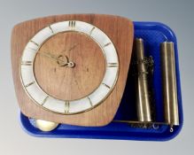 A continental teak wall clock with a pair of brass weights and pendulum.