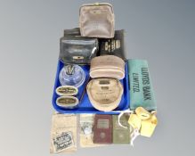A tray containing vintage banking collectables including Lloyds Bank, Savings Bank, coin bags,