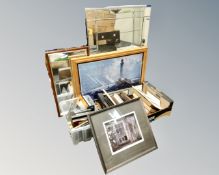 A frameless mirror together with further pictures, prints and wall coverings.