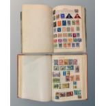 A Stanley Gibbons Swiftsure Expanding Stamp Album containing a collection of world stamps,