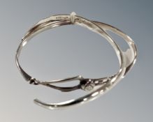 A silver bangle with Mackintosh rose front and a canted torque bracelet with London silver mark