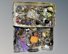 A box of pendants and brooches and a box of earrings