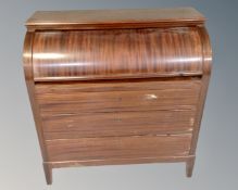 A 20th century Scandinavian mahogany cylinder fronted bureau fitted with three drawers.