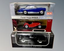 Three 1:18 scale die cast vehicles : MG TC Midget,