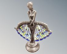 A Tiffany style table lamp modelled as a lady with fans.