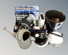 A box containing wheel trim covers, foot pump, face visor, cleaning polish kit and a watering can.