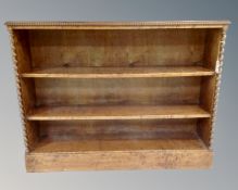 A continental open bookcase with barley twist column supports (identical to the following lot)