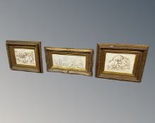 Three gilt framed relief plaques depicting cherubs, largest measures 83cm wide.