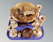 A tray containing a brass charger, a pair of silver plated candlesticks, metalwares etc.