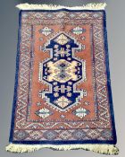A Caucasian rug on blue ground