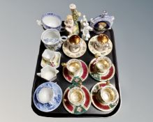 A tray of continental gilded china cups, Capodimonte miniature coffee cans on saucers,