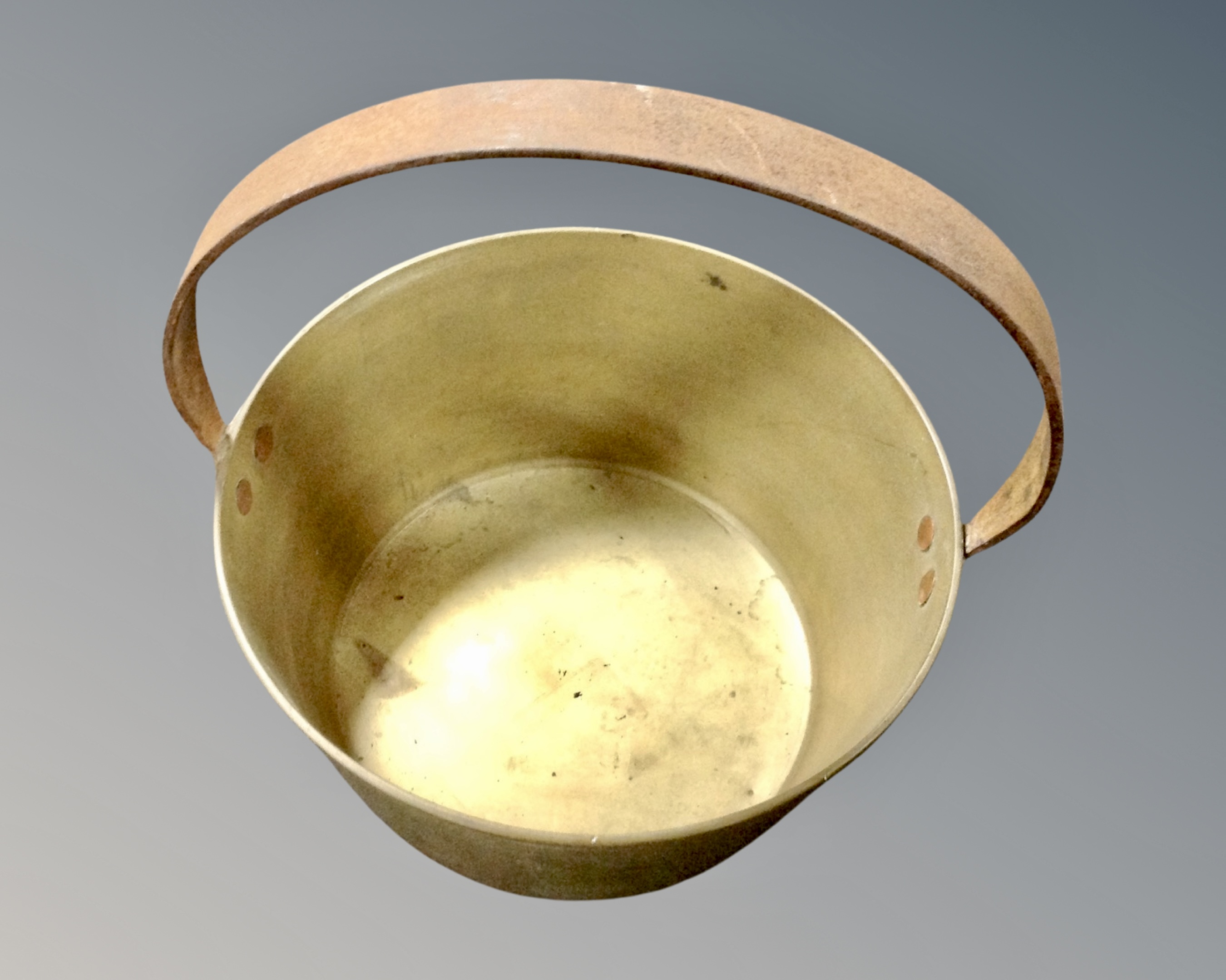 A vintage brass cast iron handled jam pan.