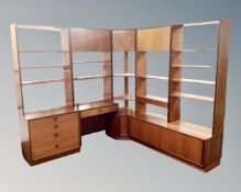 A mid 20th century teak G Plan modular corner bookcase fitted with cupboards and drawers