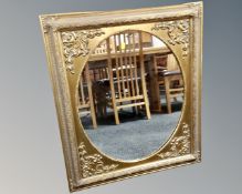 A Victorian style gilt framed wall mirror.