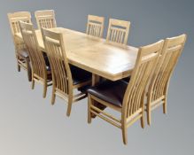 A ten-piece contemporary oak dining room suite comprising of a double door sideboard fitted with
