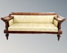 A 19th century Biedermeier flame mahogany hall settee, upholstered in a classical gold fabric.