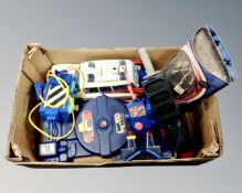A box containing vintage Ghostbusters toys including Proton Pack,