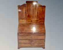 A 19th century Biedermeier mahogany bureau bookcase