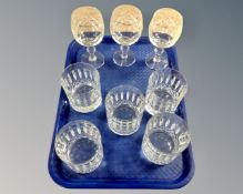 Five Waterford crystal whiskey tumblers together with three cut crystal wine glasses.