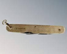 A 9ct gold mounted folding knife, length folded 63mm.
