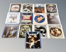 A collection of 13 vintage video discs including The Wizard of Oz, Charlie Chaplin in City Lights,