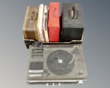 A vintage portable record player together with two cases of vinyl records 'The best of bing' etc