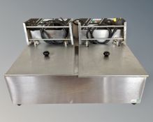 An electric stainless steel double fryer.