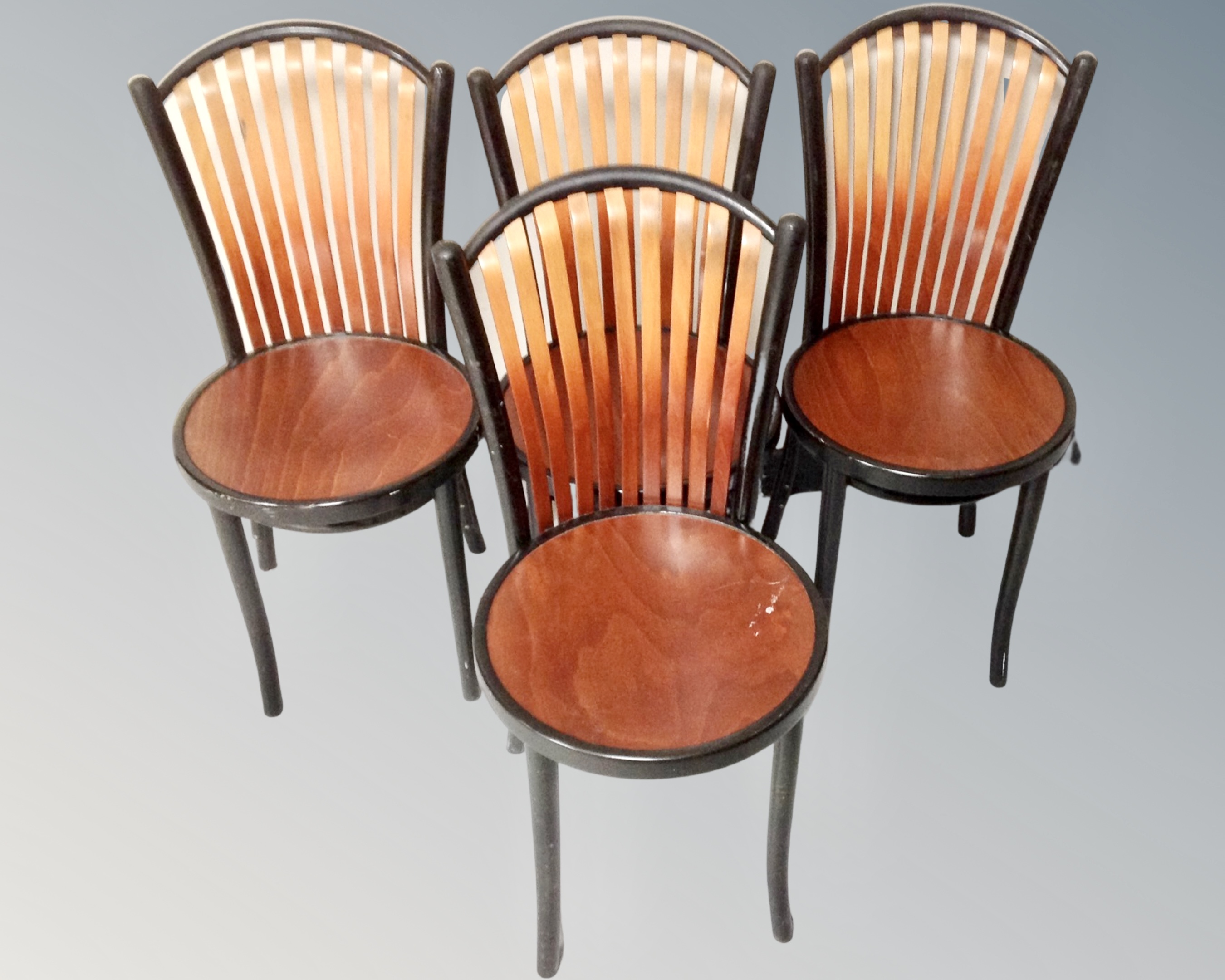 A set of four bentwood dining chairs.