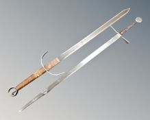 Two reproduction swords.